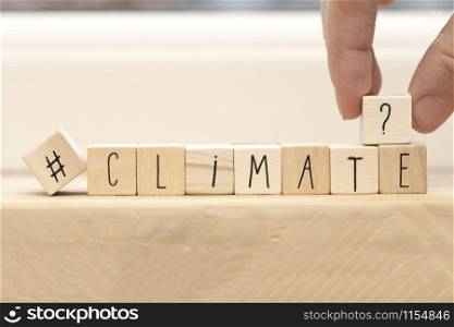 Wooden cubes with a Hashtag and the word Climate, social media and environment concept near white background space for text. Wooden cubes with a Hashtag and the word Climate, social media and environment concept near white background