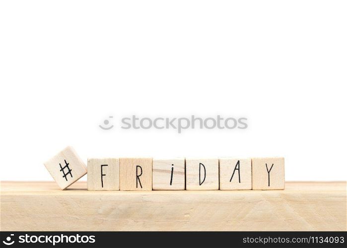 Wooden cubes with a hashtag and the word Friday, social media concept near white background close-up. Wooden cubes with a hashtag and the word Friday, social media concept near white background