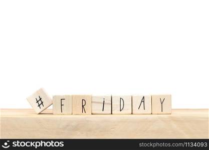 Wooden cubes with a hashtag and the word Friday, social media concept near white background close-up. Wooden cubes with a hashtag and the word Friday, social media concept near white background