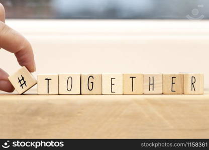 Wooden cubes with a hashtag and the word Together, social media concept space for text background. Wooden cubes with a hashtag and the word Together, social media concept space for text