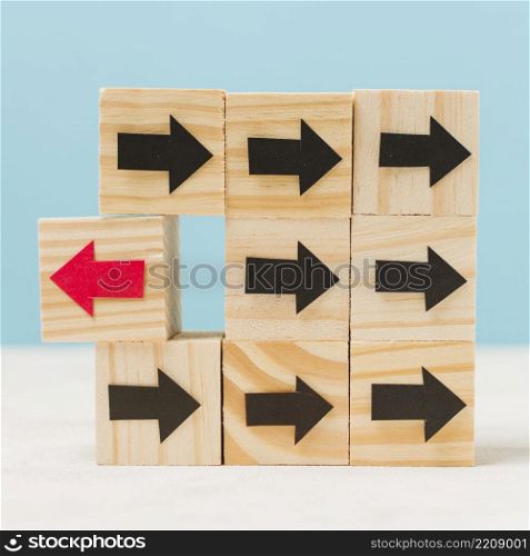 wooden cubes with arrows originality concept