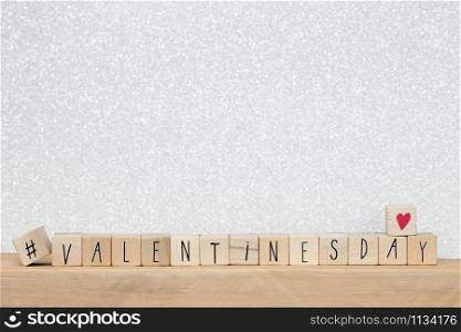 Wooden cubes with hashtag and the word valentine&rsquo;s day, social media concept background close-up. Wooden cubes with hashtag and the word valentine&rsquo;s day, social media concept background