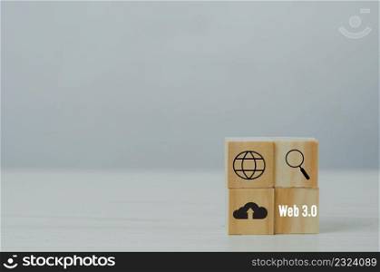 Wooden cubes with WEB 3.0 symbol on background and copy space.Business concepts.