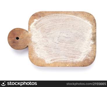 Wooden cutting board and scattered flour powder isolated on white background