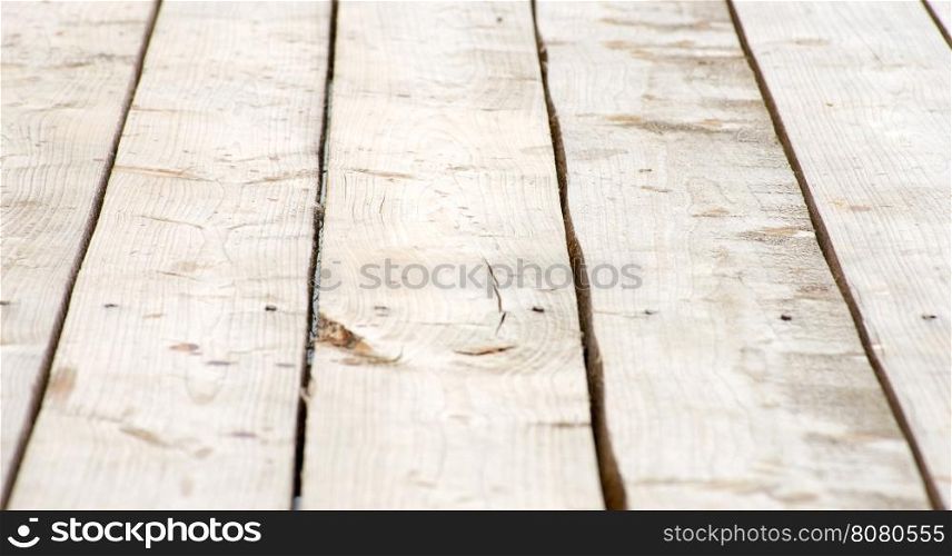 Wooden deck table on old grunge background