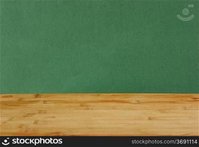 wooden deck table with green grunge background