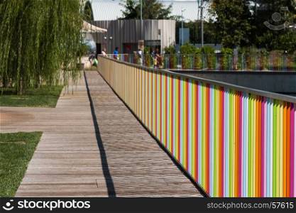 Wooden Deck with Colorful Fence near Children Playground