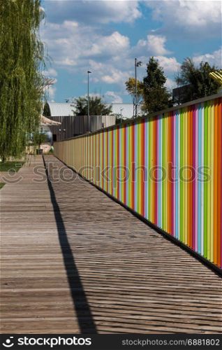 Wooden Deck with Colorful Fence near Children Playground