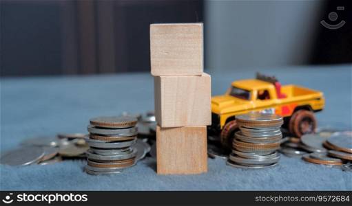 Wooden dice, coins and cars, ideas for saving money with cars Suitable for making infographics.