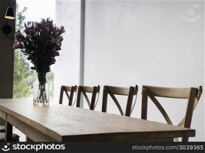 Wooden dining table in coffee shop, tock photo. Wooden dining table in coffee shop