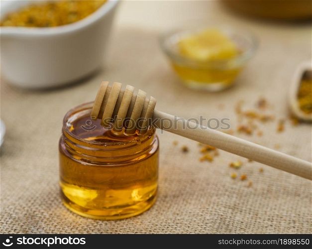 wooden dipper sticky honey. Resolution and high quality beautiful photo. wooden dipper sticky honey. High quality beautiful photo concept