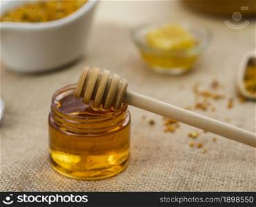 wooden dipper sticky honey. Resolution and high quality beautiful photo. wooden dipper sticky honey. High quality beautiful photo concept
