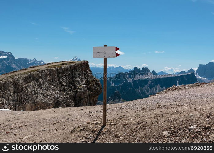 Wooden Direction Path Sign in Barren Rocky Mountain