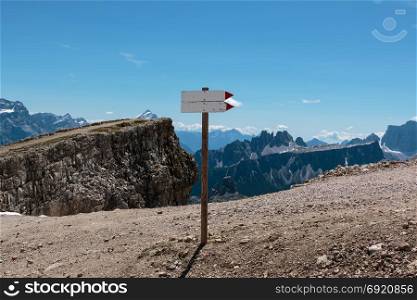 Wooden Direction Path Sign in Barren Rocky Mountain