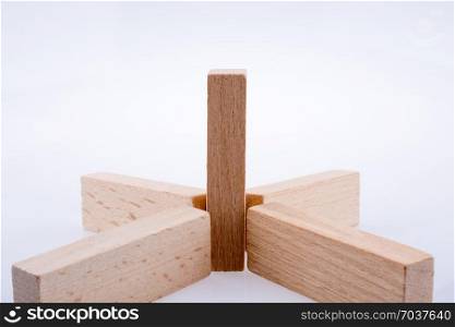 Wooden domino pieces positioned on white background