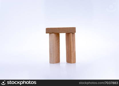 Wooden domino pieces positioned on white background