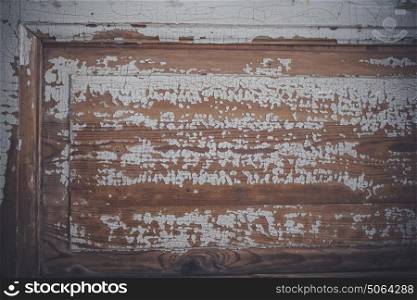 Wooden door close-up with grunge peeling paint
