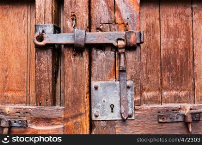 wooden door closed on the lock and latch