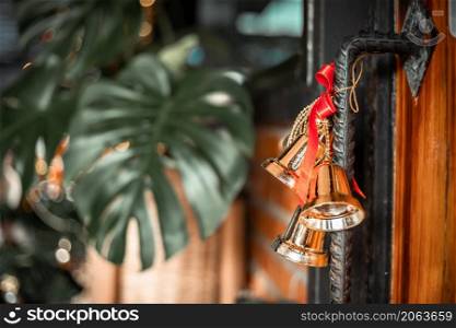 wooden door hanging bell Christmas decoration background Decoration During Christmas and New Year.