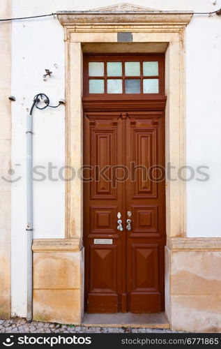 Wooden Door in the Wall of Portuguese Home