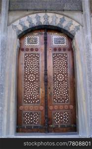 Wooden door of mosque in Manisa, Turkey