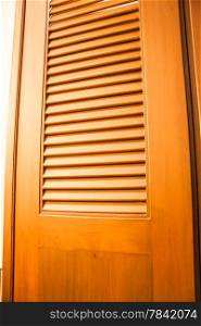 Wooden door of wardrobe with warm light