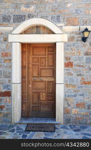 Wooden door to Orthodox church on Crete island in Greece
