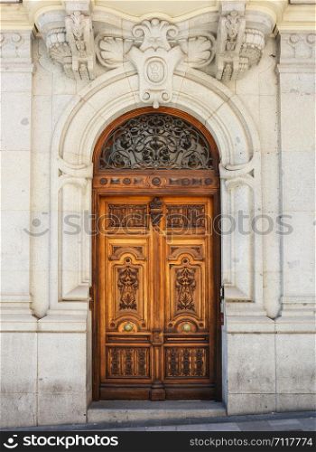 Wooden entrance door in Madrid, Spain