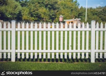 Wooden fence in white color in the park