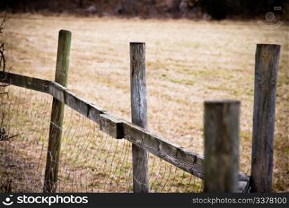 Wooden fence on a field