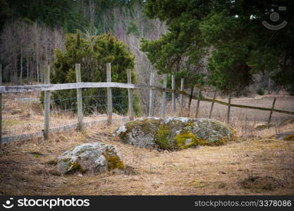 Wooden fence on a field in Sweden