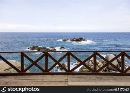 Wooden fence on the pier at Caribbean sea in Tayrona, Colombia
