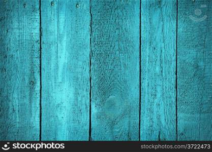 Wooden fence painted in blue color