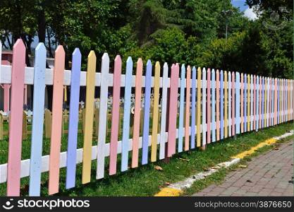 wooden fence painted in bright colors