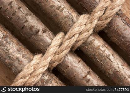 wooden fence with a rope tied