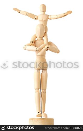 wooden figures of child sitting on neck of his parent and putting hand up, isolated on white