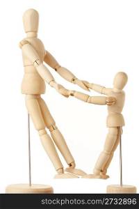 wooden figures of parent and child holding for hands, full body, side view, isolated on white