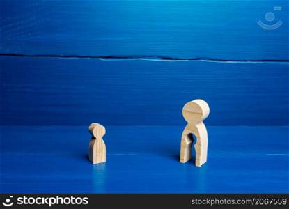 Wooden figurines of a mother with a void and a child. The concept of children leaving their parents. Deprivation of parental rights, refusal of guardianship. Surrogacy concept. Renunciation.