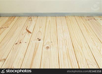 Wooden floor and fragment of plaster wall