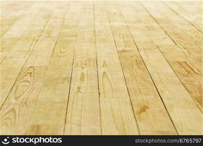 Wooden floor, consisting of thin boards, going in perspective
