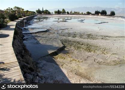 Wooden footpath and travertine formations in Pamukkale, Turkey