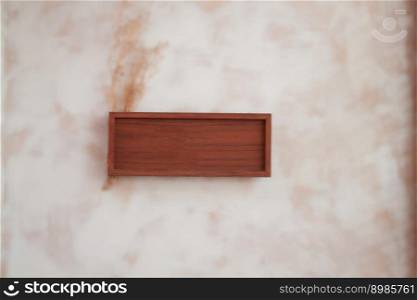Wooden frame decorated on wall, stock photo