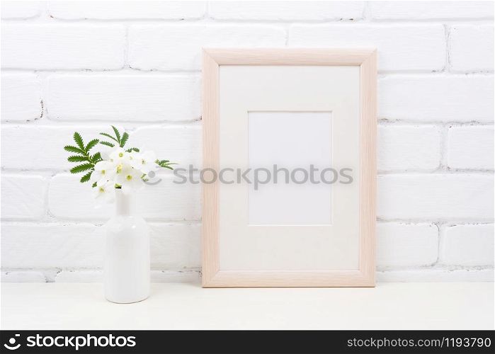 Wooden frame mockup with flowering white Tobacco plant. Empty frame mock up with Nicotiana flowers for presentation design. Template framing for modern art.