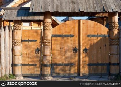 Wooden gate. A gate in ancient style