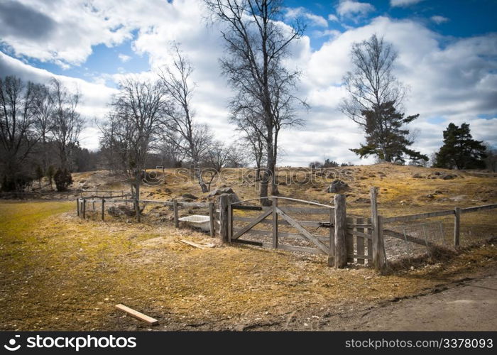 Wooden gate on a field