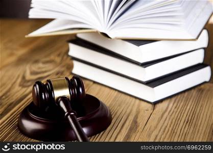 Wooden gavel and books, ambient light vivid theme