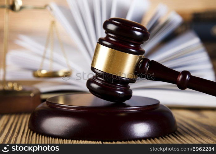 Wooden gavel and books, ambient light vivid theme