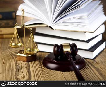 Wooden gavel and books, ambient light vivid theme