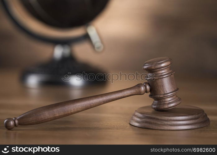 Wooden gavel and books, Law, globe concept