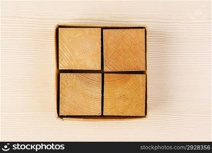 wooden geometric cube in a box